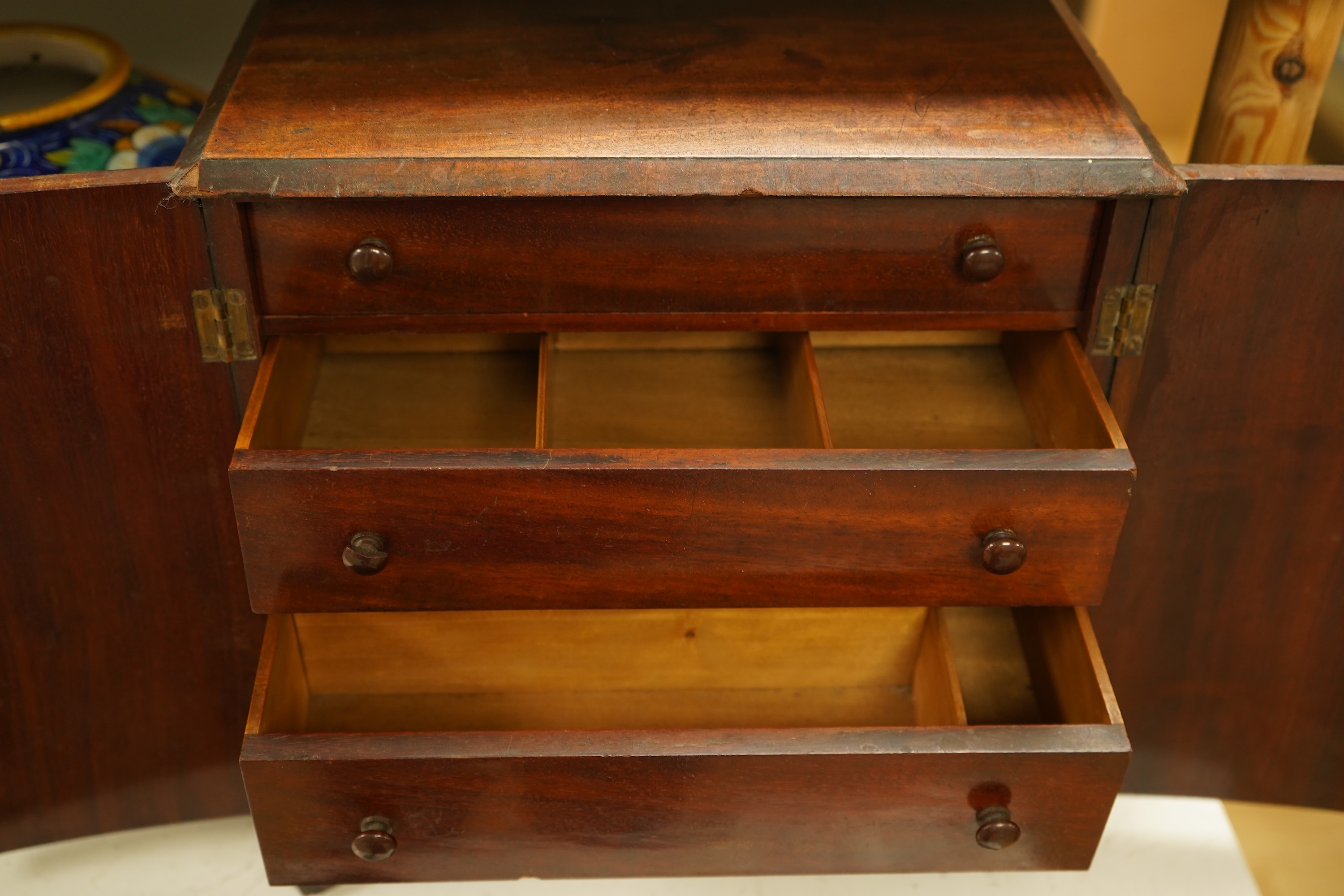 A late 19th century mahogany cabinet fitted with four drawers, 32cm high
